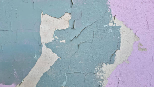istock Peeling paint on an old wall. Grunge background for design 2165562936