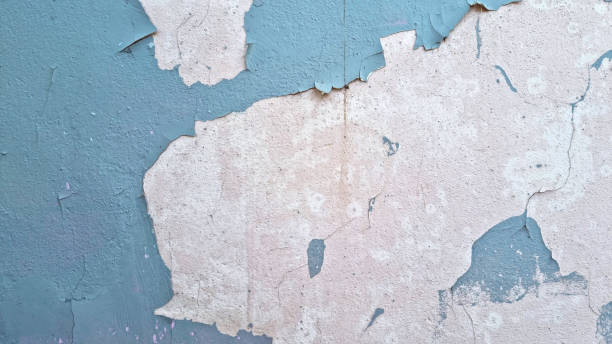 istock Peeling paint on an old wall. Grunge background for design 2165563160