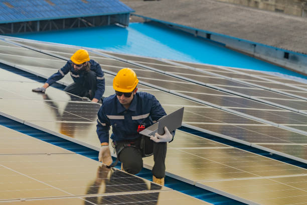 istock engineer man inspects construction of solar cell panel or photovoltaic cell by electronic device. Industrial Renewable energy of green power. factory worker working on tower roof. 2165571678