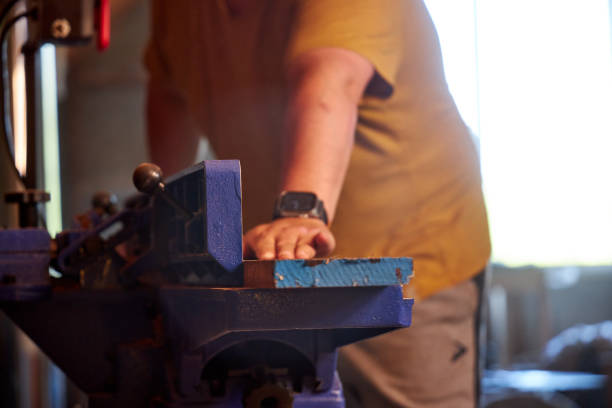 istock man sawing wood on a jointer in a home workshop 2165574196