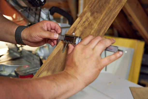 istock a man in a home carpentry workshop measures boards with a caliper close-up of hands 2165574964