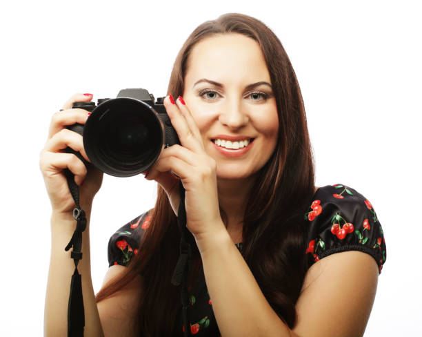 istock Cheerful young woman making photo 2165575243