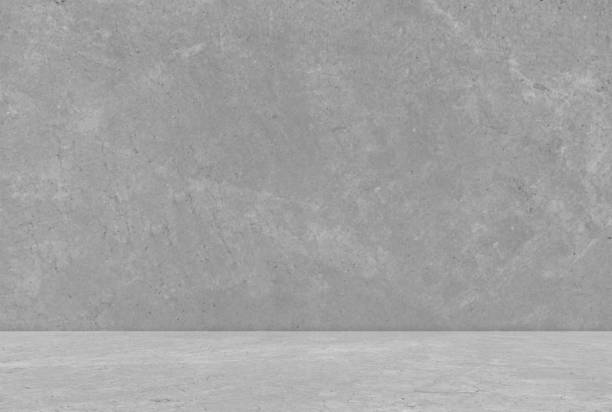 istock Empty gray concrete room studio background. Background for displaying product. 2165575359