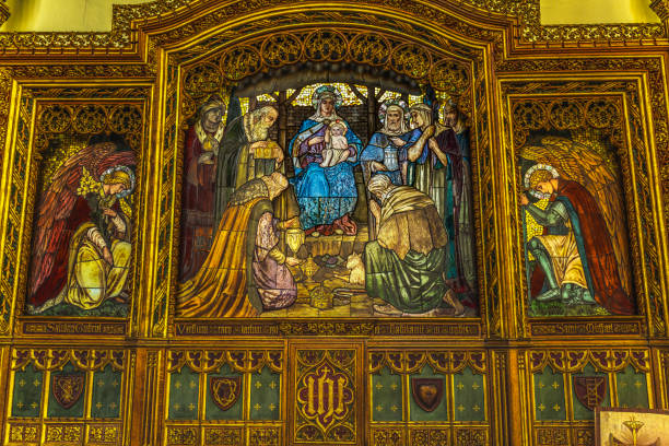 Editorial image of colorful stained glass windows in a Catholic church in Poland, showing traditional Christian art and sacred interior design.