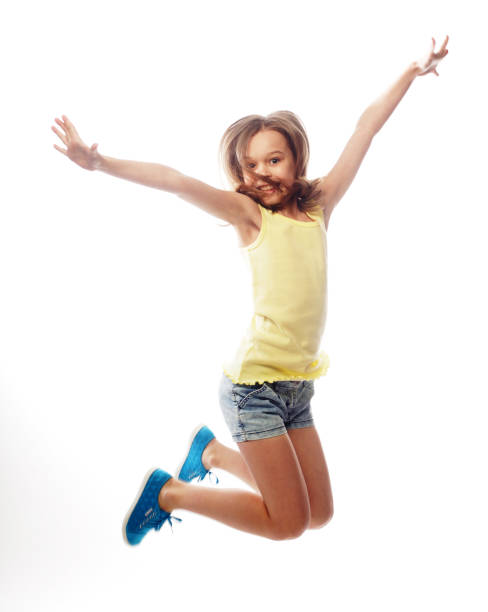istock girl jumps on a white background 2165576713