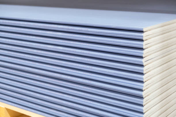 istock Special gypsum board with enhanced sound insulation Plasterboard. Panel Type DF for indoor concrete walls prepared for construction 2165579738