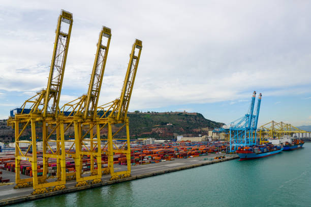 Close up of  a crane operators cabin unloading shipping containers at Gijon port in Northern Spain