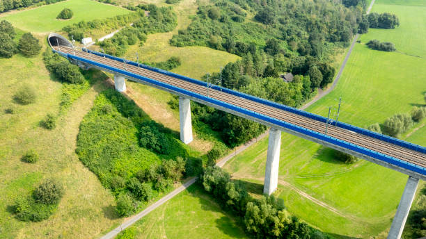 istock Highspeed train railroad track - bridge and tunnel entrance 2165580657