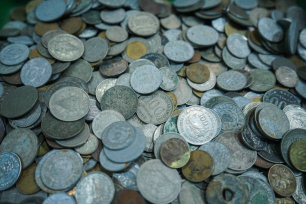 Yogyakarta, indonesia July 30, 2024\nPicture pile of old rupiah coins, a pile of old rupiah coins that are no longer valid