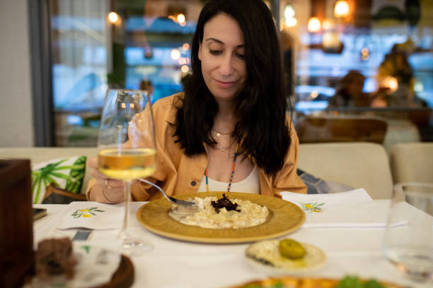 istock Woman drinking wine with eating gnocchi at dinner 2165594500