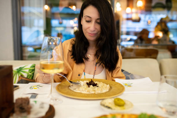istock Woman drinking wine with eating gnocchi at dinner 2165594518