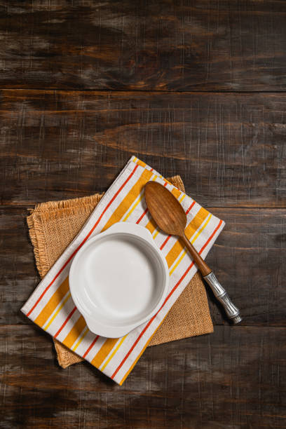 istock bowl mock up on striped kitchen cloth with rustic wooden spoon 2165595308