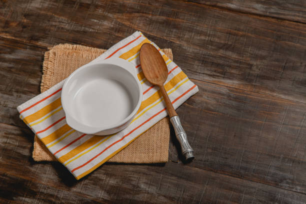 istock bowl mock up on striped kitchen cloth with rustic wooden spoon 2165595330