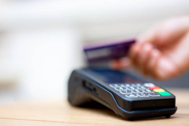 istock Digital Finance. Man Making a Payment with a Credit Card 2165596305