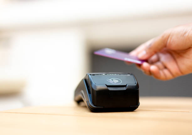 istock Man Completing Transaction with Credit Card 2165596306