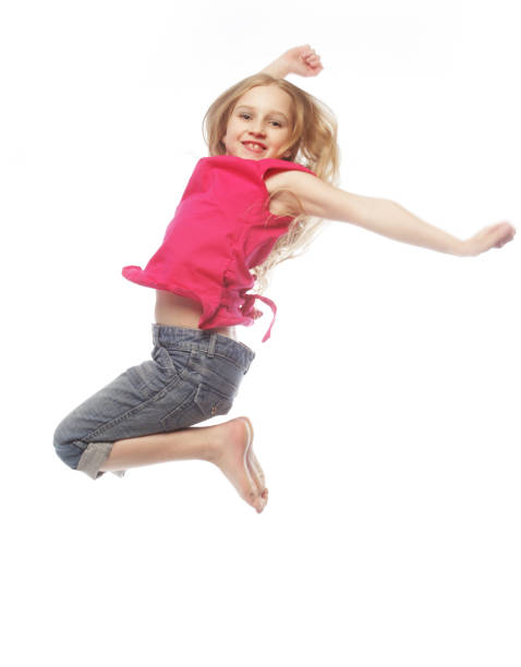 istock girl jumps on a white background 2165597526