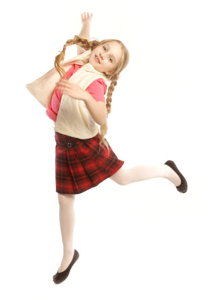 happy girl jumps on a white background