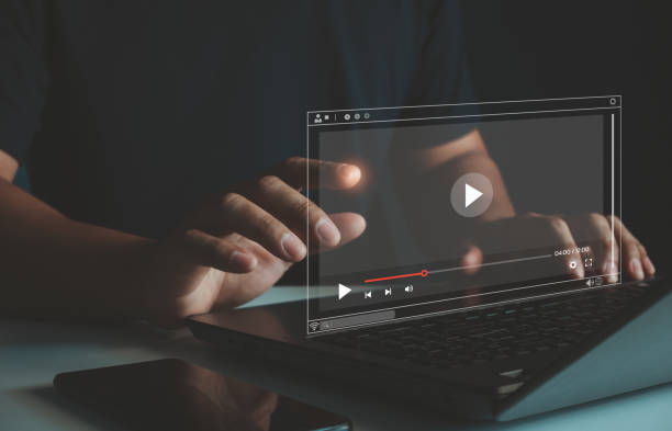 istock Streaming online, watching video on internet, live concert, show or tutorial. Person watching online movie or TV series on laptop computer screen. Concept about subscription based live digital stream. 2165598718