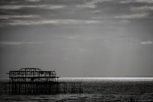 The English Channel - Kings Road in Brighton – August 2, 2024. The West Pier, a significant cultural symbol of the nearby Brighton Palace Pier in Brighton, Brighton's seafront Natural Beauty around the Brighton area.