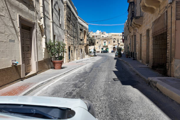 istock POV perspective driving through old village, Gozo 2165602540