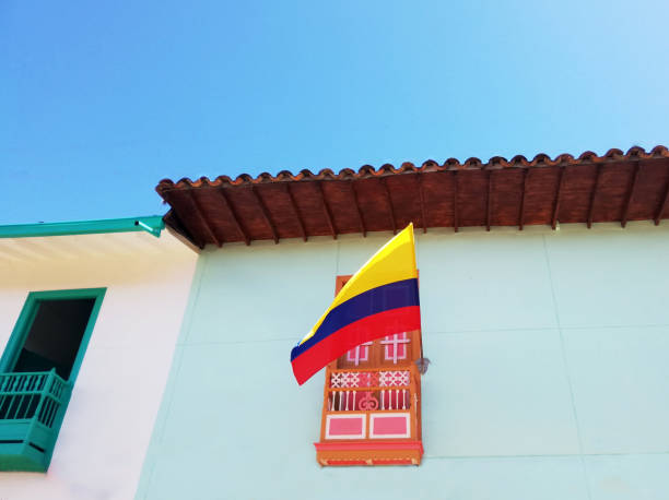 Low angle shot of a Colombian flag on a balcony