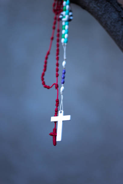 istock Two Hanging Rosary Beads with Crosses (Red and White) 2165612473
