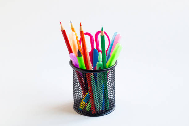 Markers in a grid. Box for pens. Item in the interior. Drawing tools.