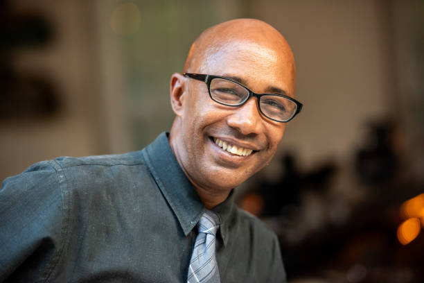 istock Smiling bald mature afro caribbean man looking at the camera 2165620677