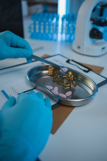 istock a scientist is testing various pills in order to improve their quality an effectiveness in the laboratory, a chemist is testing the chemistry of various pill capsules in a medicine laboratory 2165627415