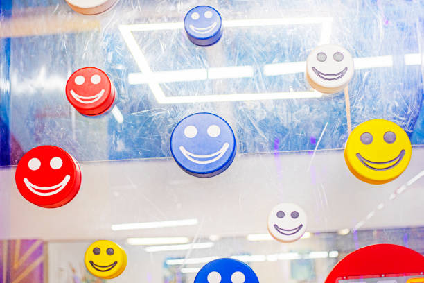 decorative multi-colored emoticons on the door to the development center. back to school