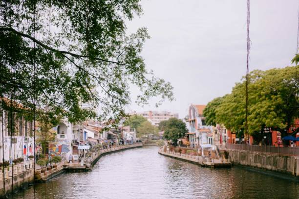 istock Melaka City River Side Canal View with Large Trees 2165630377