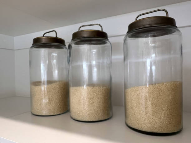 istock Rice grains in vintage glass containers 2165632933