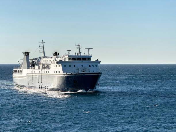 istock Ferry boat sailing on rippled sea, blue sky background 2165636487