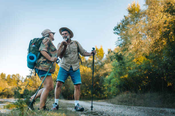 istock Senior couple walking outdoors together , hiking 2165636632