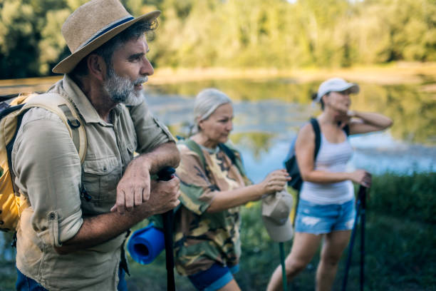 istock Group of seniors hiking and exploring the forest 2165637097
