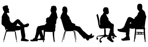 istock silhouette of a group men sitting on chair 2165637245