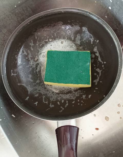 istock pan with food in sink waiting to be cleaned 2165638122
