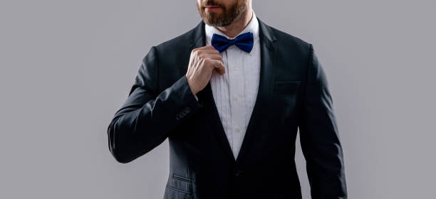 istock man in formal tuxedo isolated on grey background. formal tuxedo man in studio. 2165640150