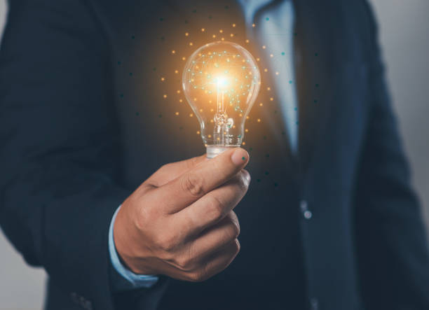 istock Big data concept: hand-holding light bulb (idea) and global internet connection, global internet connection application technology, digital marketing, financial and banking, digital technology nomads. 2165640392