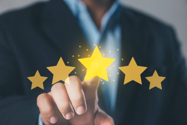istock Feedback rating, positive customer review experience, satisfaction survey. Customer Experience Concept. Hand-pressing on a five-star rating. 2165640398