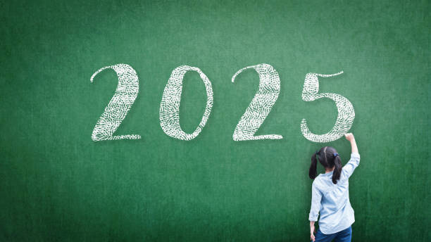 istock 2025 Happy new year school class academic calendar with student kid's hand drawing greeting on teacher's green chalkboard for educational celebration, back to school, education classroom schedule backdrop 2165640468