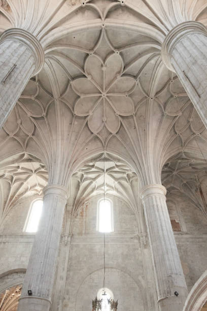 istock Gothic vaulted ceiling with ribbed columns in historic church interior 2165640860