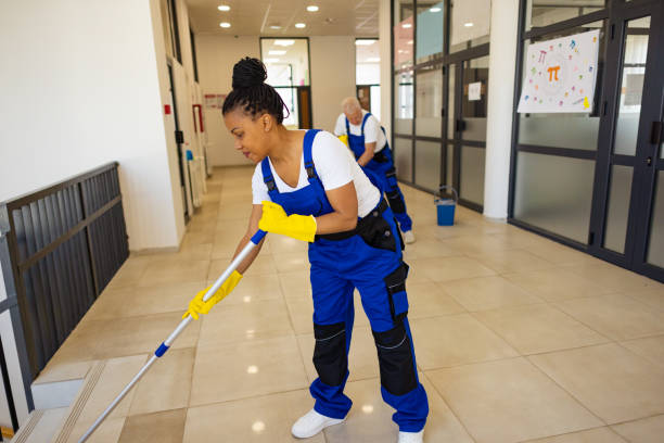istock Janitors cleaning the  floor in school hallway 2165642173
