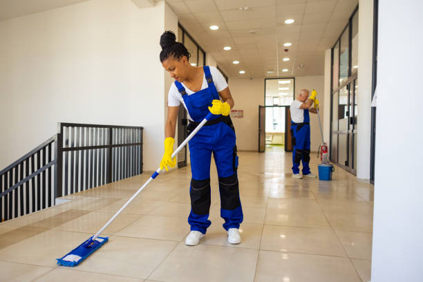 istock Two Janitors in uniform cleaning the  floor in school hallway 2165642535