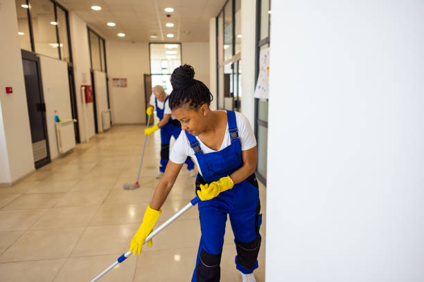 istock Janitors cleaning the  floor in school hallway 2165642894