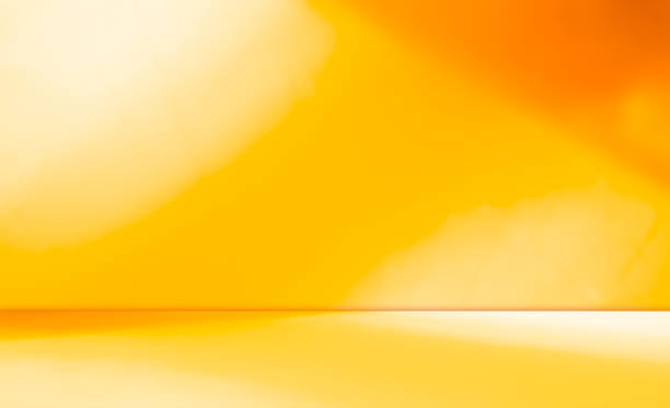 istock Autumn background yellow studio room abstract shadow on wall floor blur cement, podium minimal cosmetic presentation, yellow orange cement empty backdrop platform stage table loft scene mockup podium. 2165643081