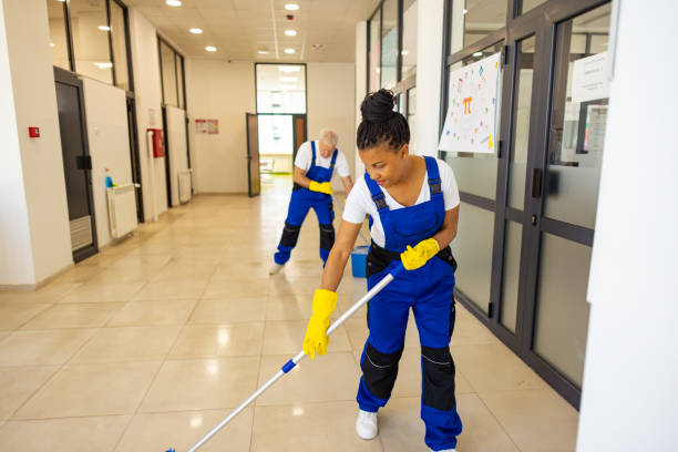 istock Janitors cleaning the  floor in school hallway 2165643163
