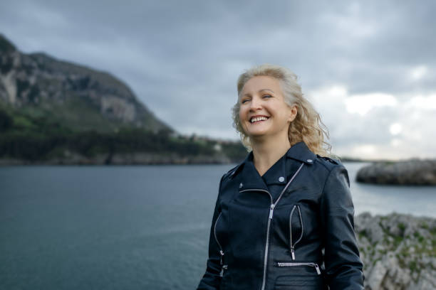 A woman walks along the seashore in the Bay of Biscay
