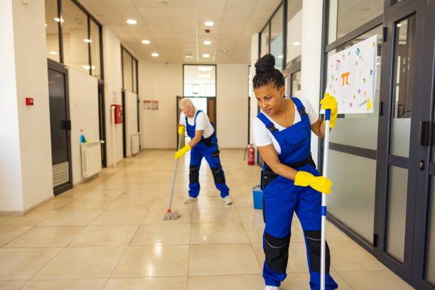 istock Janitors cleaning the  floor in school hallway 2165643369