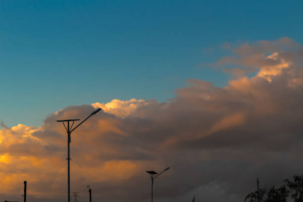 Looking at stunning golden clouds at sunset. The clouds look like they were painted.